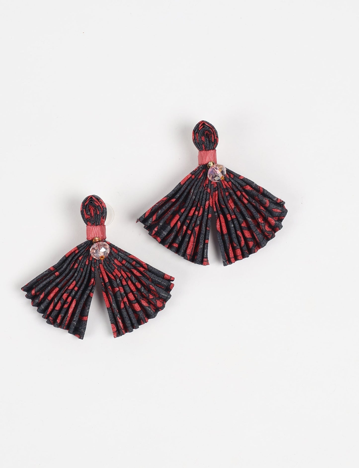 Adorn yourself sustainably with our PLEATED EARRINGS – fan-shaped wonders with a top knot and a tiny stone. Meticulously hand-pleated from Indian saris, these earrings reflect ethical clothing, green fashion, and slow fashion. Fastened with hypoallergy tested metal hooks, nickel, and lead-free, making them a conscious and stylish accessory.