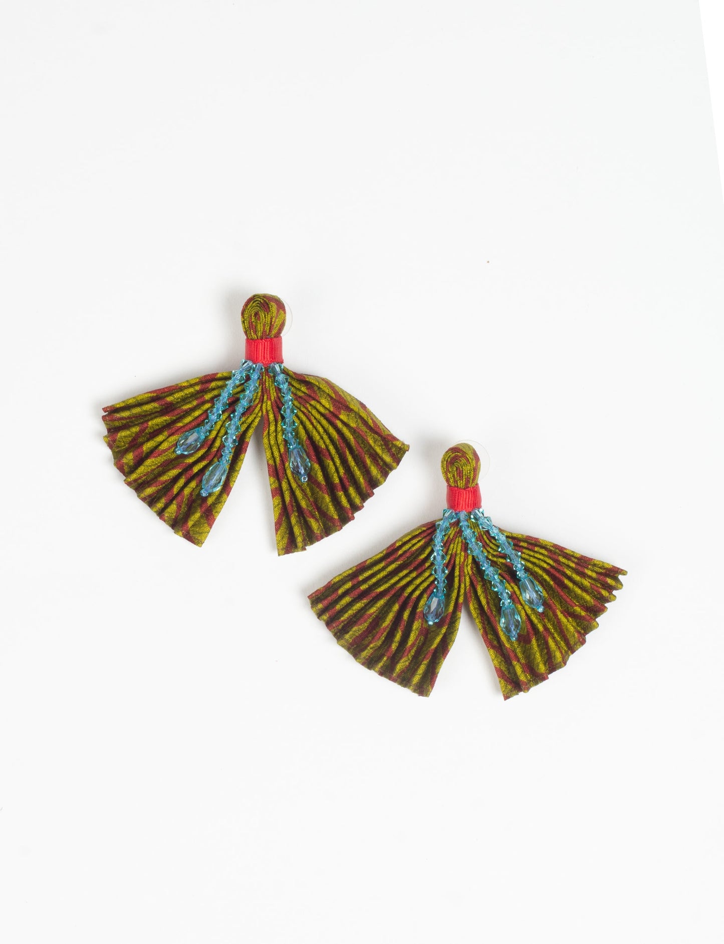 Elevate your look with our PLEATED EARRINGS – embellished with a beaded dangler, diamond-shaped metallic plate, and hook fastening. Crafted with innovative heat setting techniques on pre-loved saris, these earrings showcase ethical clothing, green fashion, and zero waste fashion. Hypoallergy tested metal hooks, nickel, and lead-free for a conscious and stylish accessory.