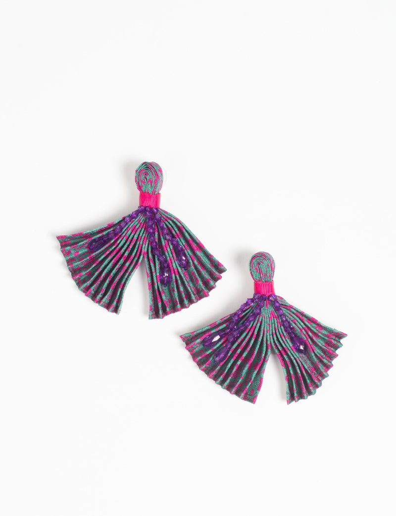 Pair of pleated fabric earrings in pink and green abstract pattern with purple bead accents, shown flat on white background