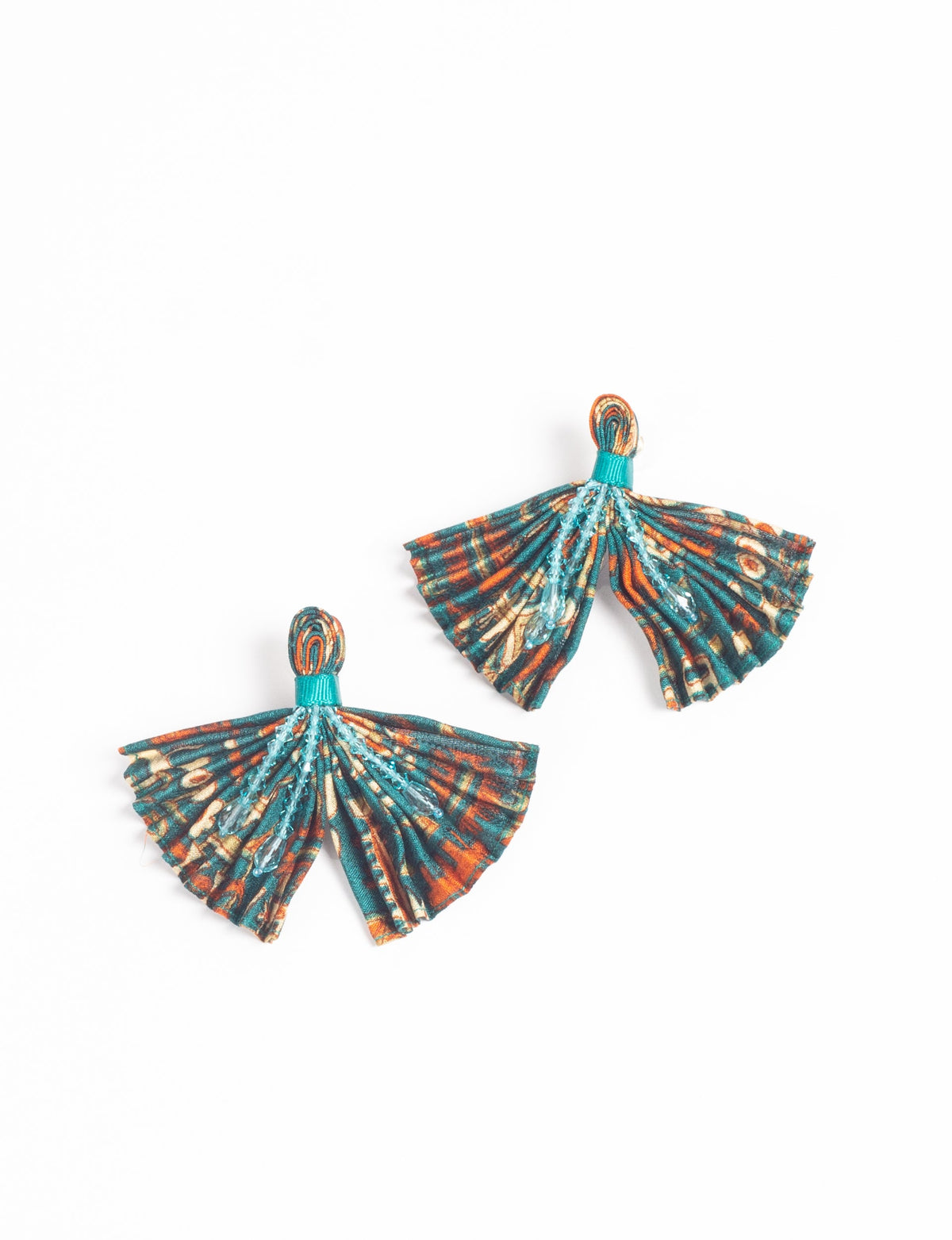 Pleated fabric earrings with teal, orange, and beige abstract pattern and blue bead embellishments, shown flat on white background