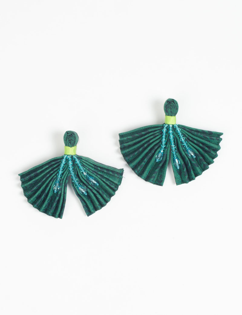 Blue pleated fabric earrings with green tops and hanging blue bead embellishments, shown flat on white background