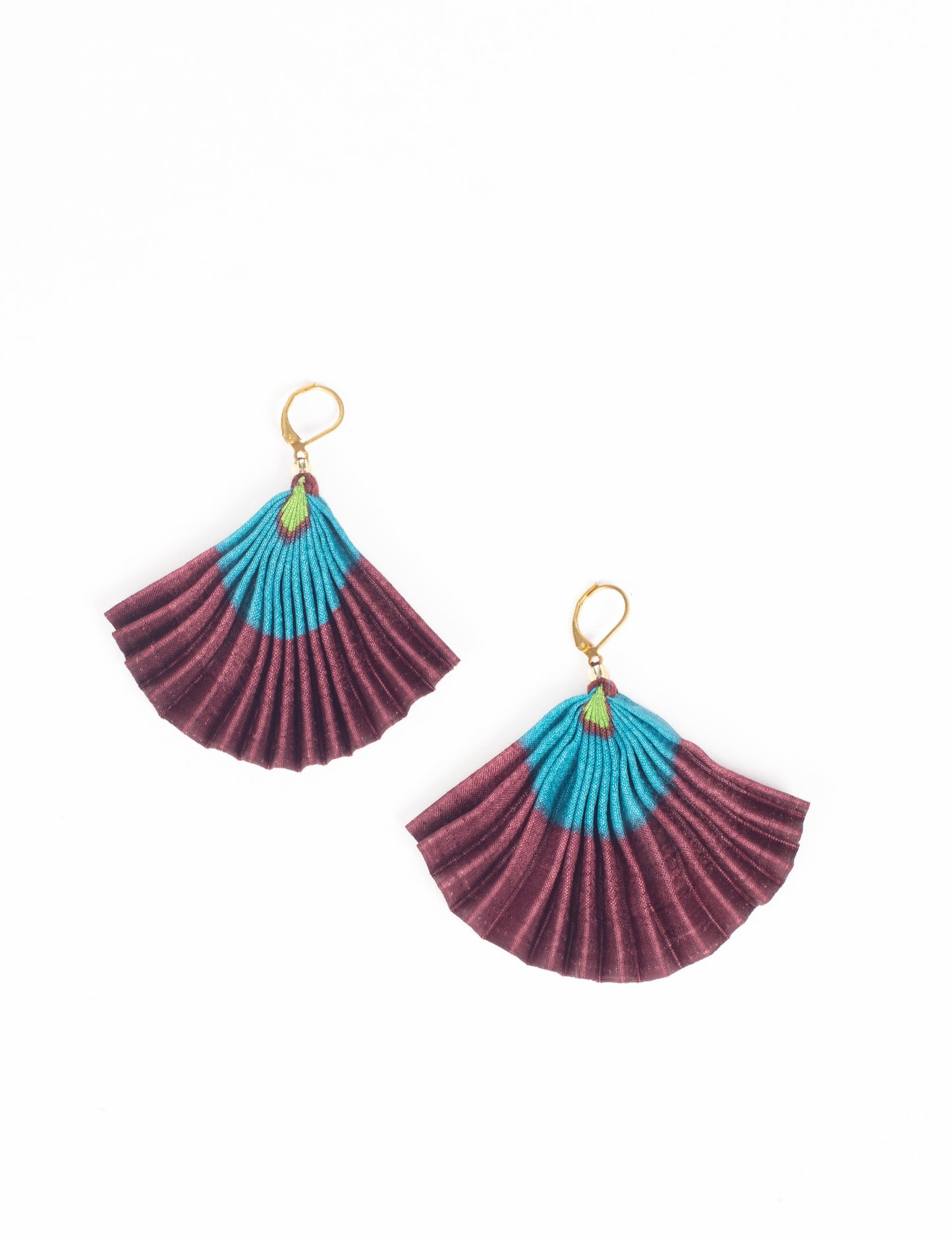 Elevate your style sustainably with our PLEATED EARRINGS – a timeless creation from pre-loved Indian saris, crafted using innovative heat setting techniques. Align with ethical clothing, green fashion, and slow fashion, these earrings are a statement of mindful elegance. Hypoallergy tested metal hooks make them a skin-friendly, sustainable choice.