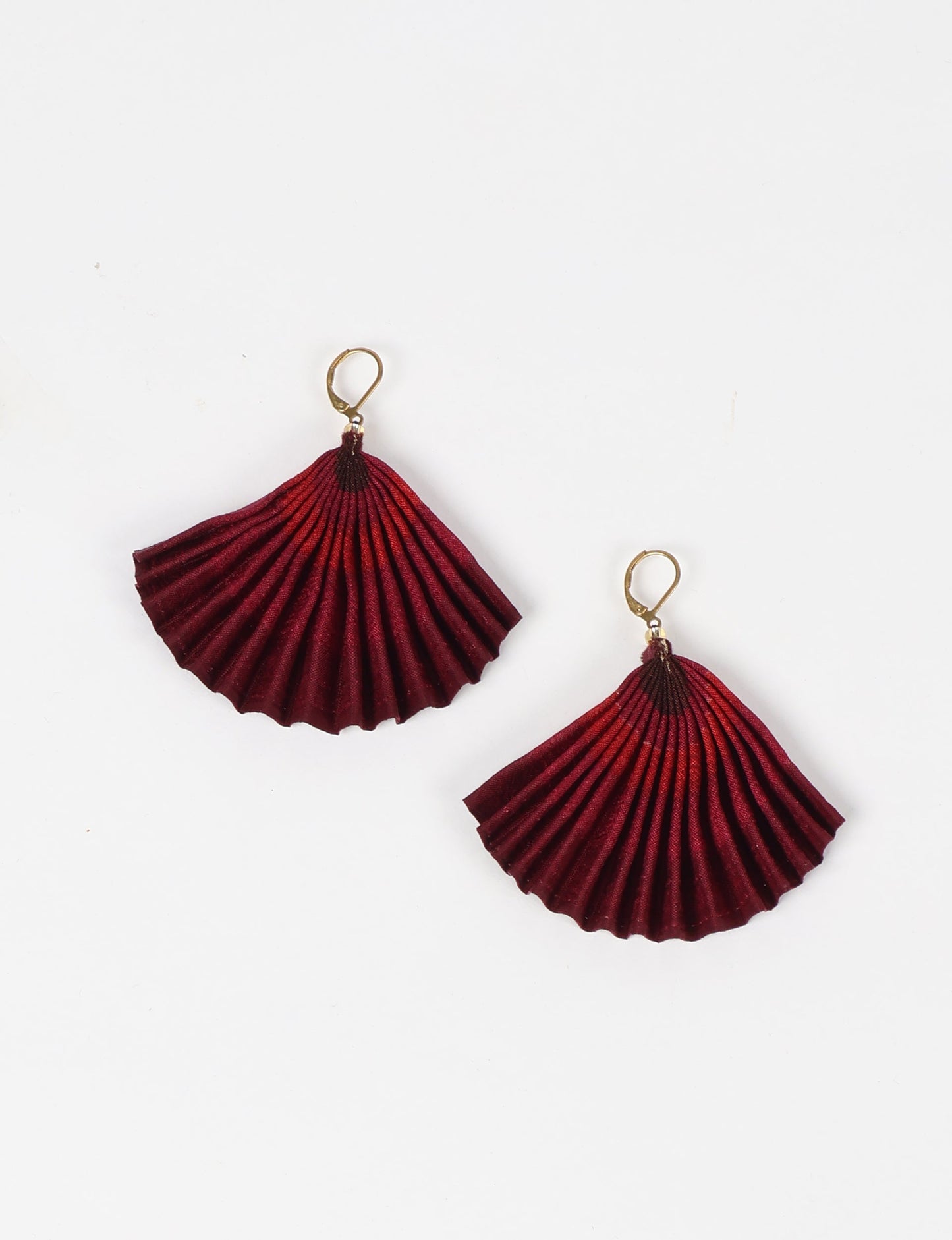 Elevate your style sustainably with our PLEATED EARRINGS – a timeless creation from pre-loved Indian saris, crafted using innovative heat setting techniques. Align with ethical clothing, green fashion, and slow fashion, these earrings are a statement of mindful elegance. Hypoallergy tested metal hooks make them a skin-friendly, sustainable choice.