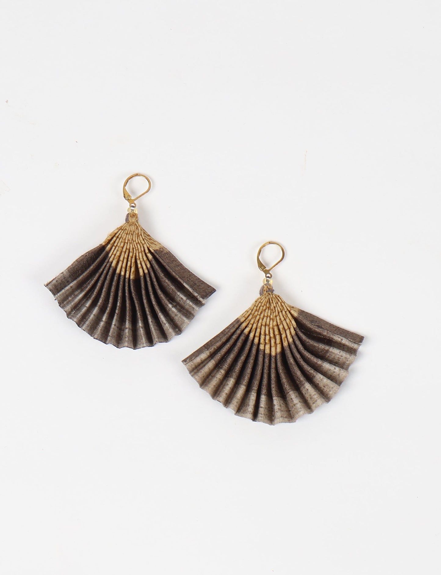 Elevate your style sustainably with our PLEATED EARRINGS – a timeless creation from pre-loved Indian saris, crafted using innovative heat setting techniques. Align with ethical clothing, green fashion, and slow fashion, these earrings are a statement of mindful elegance. Hypoallergy tested metal hooks make them a skin-friendly, sustainable choice.
