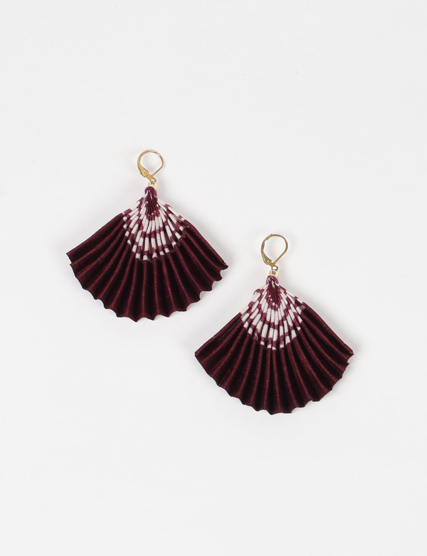 Elevate your style sustainably with our PLEATED EARRINGS – a timeless creation from pre-loved Indian saris, crafted using innovative heat setting techniques. Align with ethical clothing, green fashion, and slow fashion, these earrings are a statement of mindful elegance. Hypoallergy tested metal hooks make them a skin-friendly, sustainable choice.