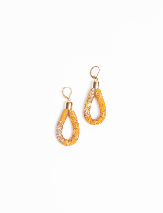 Elevate your style sustainably with our Rope Earrings. Crafted from cotton rope hand-wrapped with pre-loved saris, these earrings are a testament to ethical and green fashion. Make a conscious choice for a brighter, eco-friendly future.