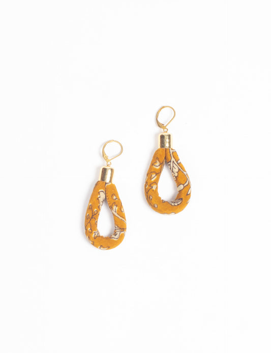 Elevate your style sustainably with our Rope Earrings. Crafted from cotton rope hand-wrapped with pre-loved saris, these earrings are a testament to ethical and green fashion. Make a conscious choice for a brighter, eco-friendly future.