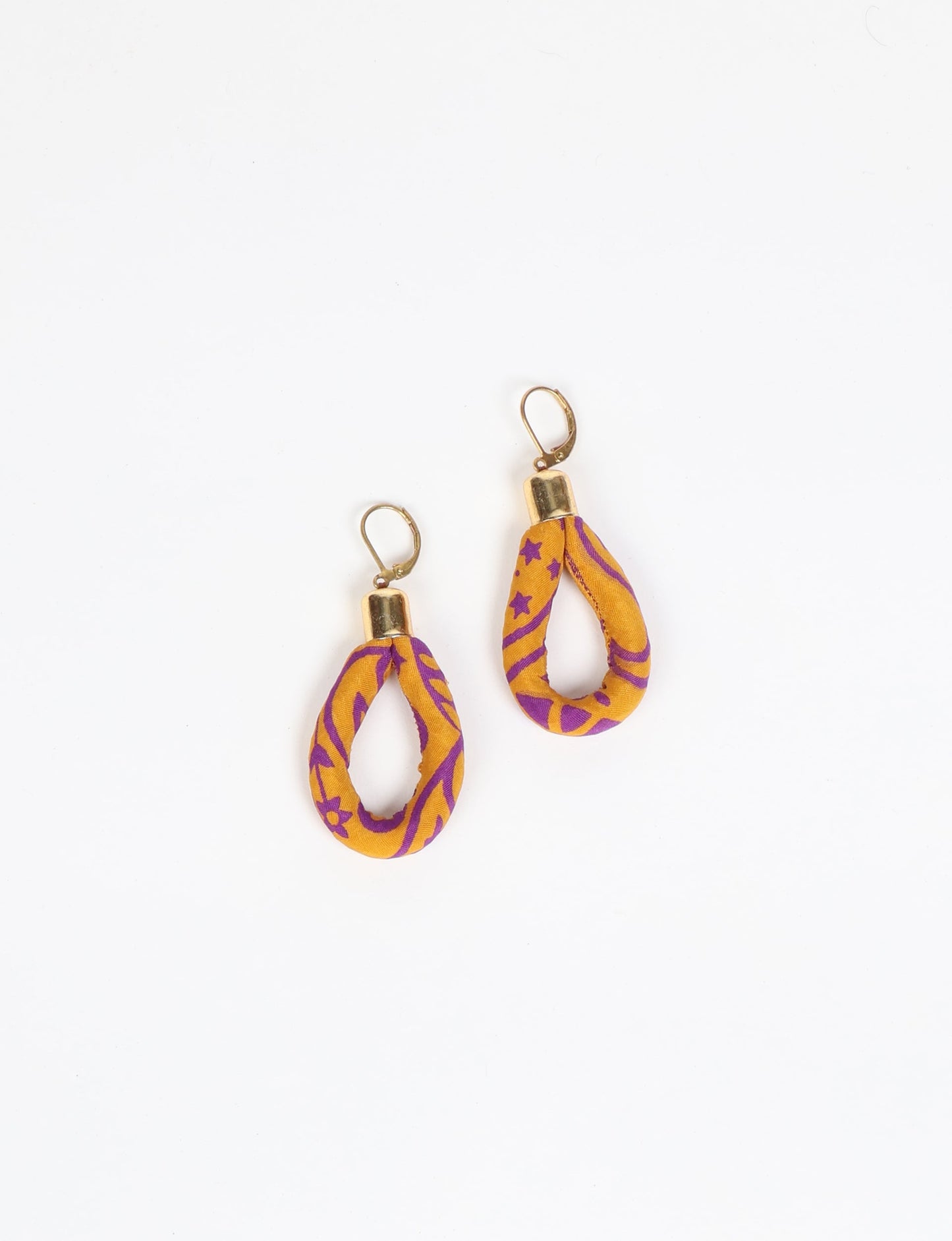 Elevate your style sustainably with our Rope Earrings. Crafted from cotton rope hand-wrapped with pre-loved saris, these earrings are a testament to ethical and green fashion. Make a conscious choice for a brighter, eco-friendly future.
