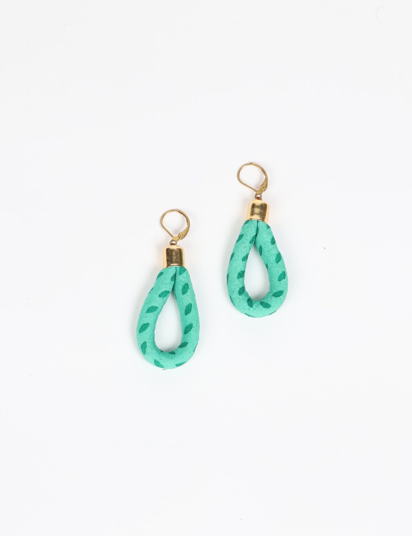 Elevate your style sustainably with our Rope Earrings. Crafted from cotton rope hand-wrapped with pre-loved saris, these earrings are a testament to ethical and green fashion. Make a conscious choice for a brighter, eco-friendly future.
