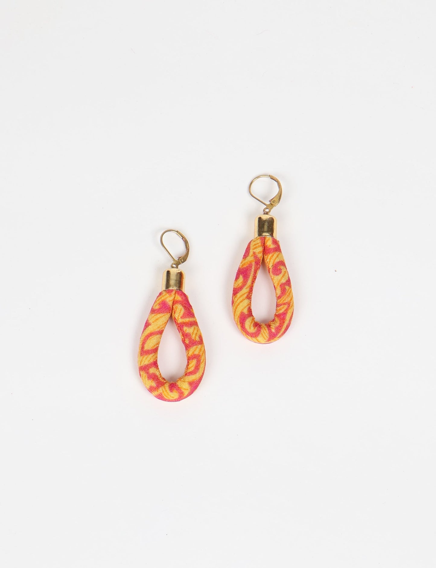 Elevate your style sustainably with our Rope Earrings. Crafted from cotton rope hand-wrapped with pre-loved saris, these earrings are a testament to ethical and green fashion. Make a conscious choice for a brighter, eco-friendly future.