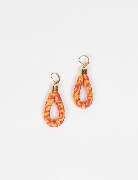 Elevate your style sustainably with our Rope Earrings. Crafted from cotton rope hand-wrapped with pre-loved saris, these earrings are a testament to ethical and green fashion. Make a conscious choice for a brighter, eco-friendly future.
