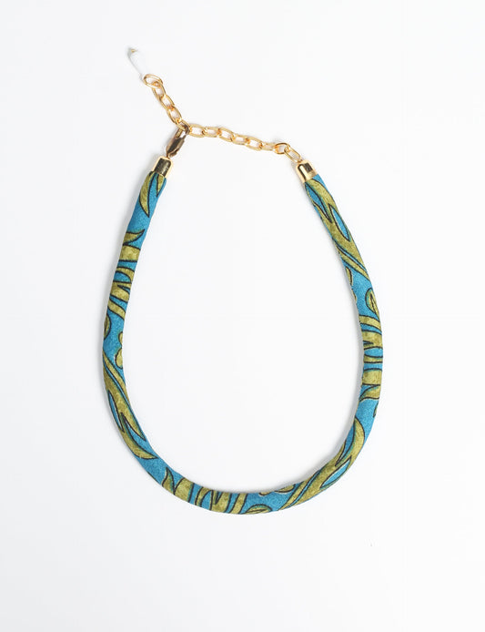 Elevate your look sustainably with our Rope Necklace. Crafted using cotton rope hand-wrapped with pre-loved Indian saris, this necklace is a testament to ethical and green fashion. Make a conscious choice for a brighter, eco-friendly future with this unique, upcycled accessory.