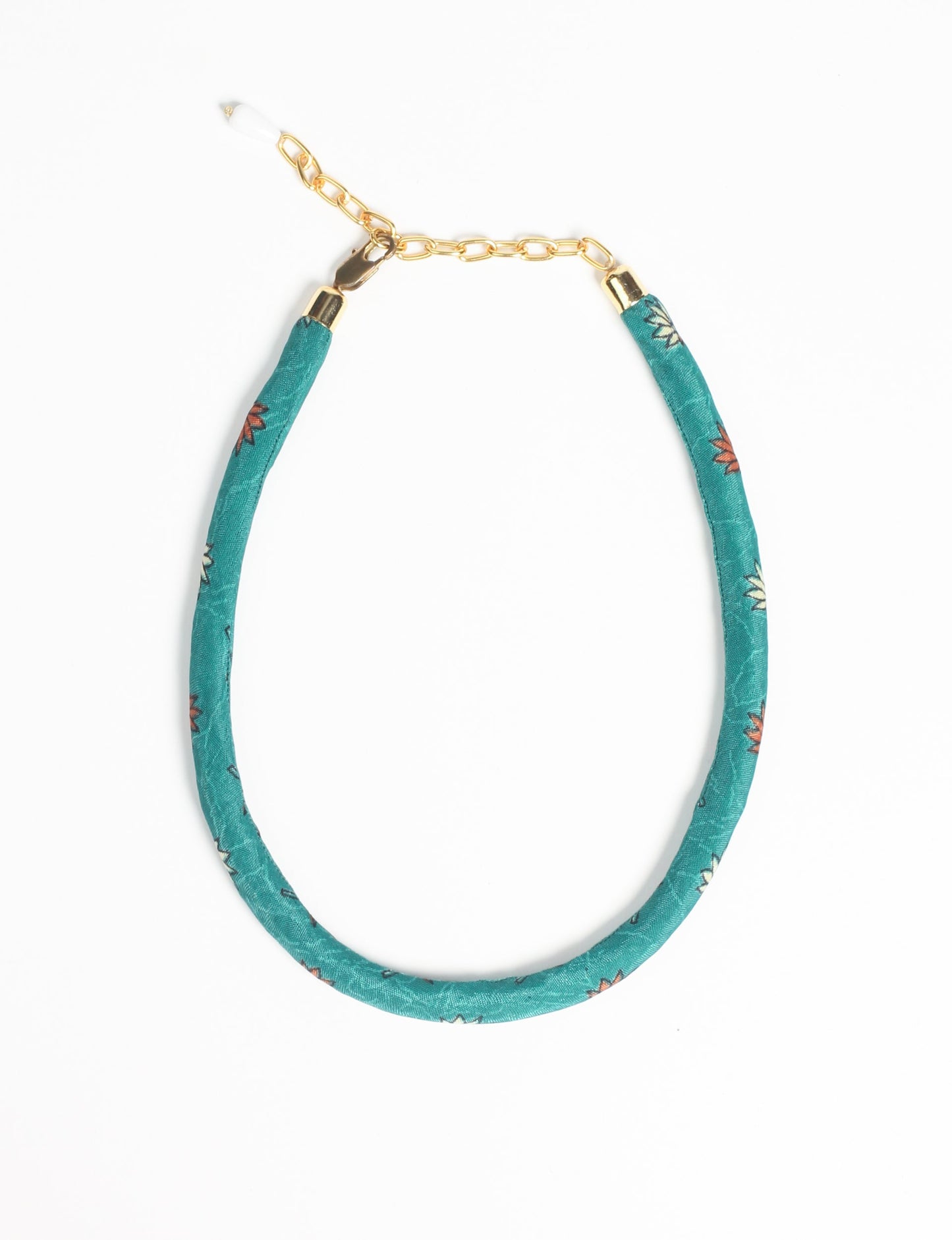 Elevate your look sustainably with our Rope Necklace. Crafted using cotton rope hand-wrapped with pre-loved Indian saris, this necklace is a testament to ethical and green fashion. Make a conscious choice for a brighter, eco-friendly future with this unique, upcycled accessory.