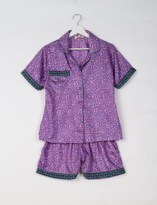 Indulge in comfort and style with our PJ Set Short, now with short sleeves. Crafted from upcycled saris, these shorts embody a zero-waste mentality for sustainable sleepwear. Versatile from day to night, perfect for beach lounging or poolside yoga, these pajamas redefine conscious fashion.