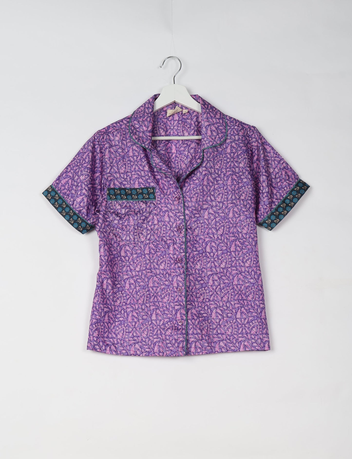 Indulge in comfort and style with our PJ Set Short, now with short sleeves. Crafted from upcycled saris, these shorts embody a zero-waste mentality for sustainable sleepwear. Versatile from day to night, perfect for beach lounging or poolside yoga, these pajamas redefine conscious fashion.