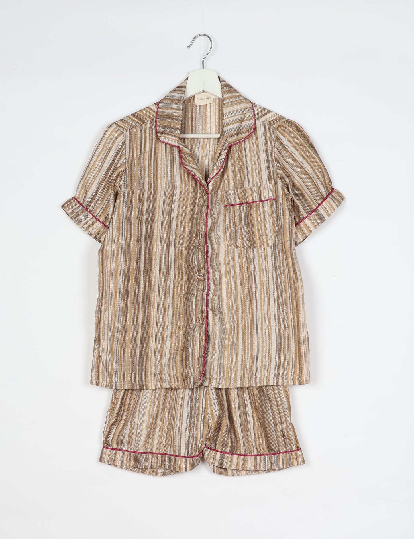 Indulge in comfort and style with our PJ Set Short, now with short sleeves. Crafted from upcycled saris, these shorts embody a zero-waste mentality for sustainable sleepwear. Versatile from day to night, perfect for beach lounging or poolside yoga, these pajamas redefine conscious fashion.