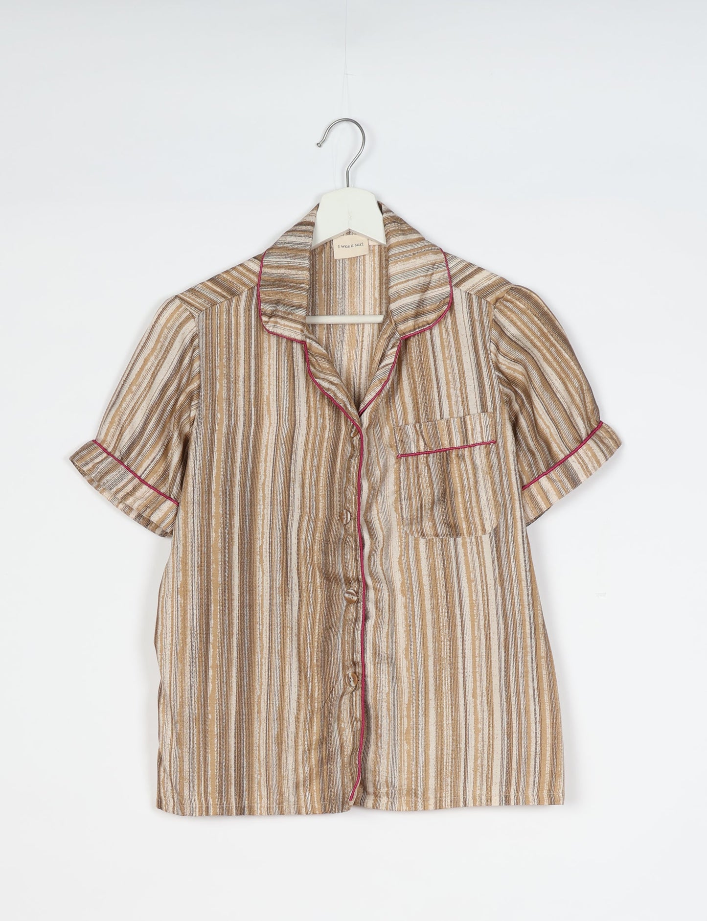 Indulge in comfort and style with our PJ Set Short, now with short sleeves. Crafted from upcycled saris, these shorts embody a zero-waste mentality for sustainable sleepwear. Versatile from day to night, perfect for beach lounging or poolside yoga, these pajamas redefine conscious fashion.