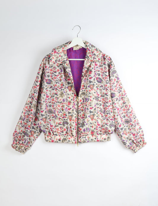 Upcycled Bomber Jacket made from recycled sari materials, featuring a cute cropped shape, elasticated hem and cuffs, and contrast sari print lining. Sustainable apparel promoting eco-friendly fashion and ethical clothing.