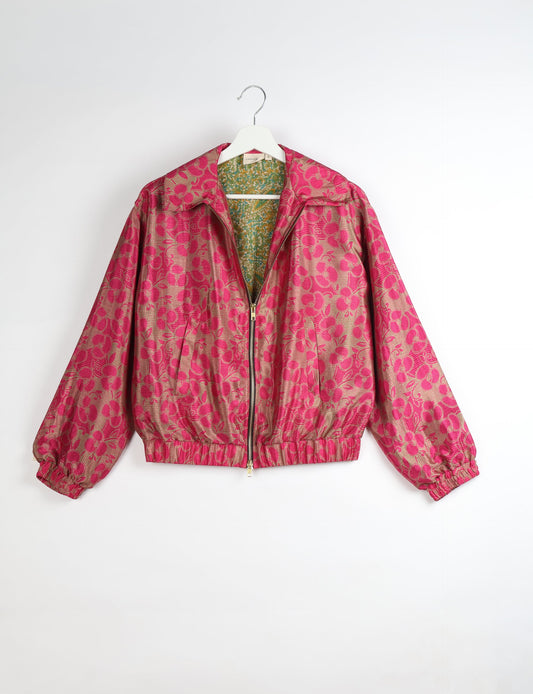 Upcycled Bomber Jacket made from recycled sari materials, featuring a cute cropped shape, elasticated hem and cuffs, and contrast sari print lining. Sustainable apparel promoting eco-friendly fashion and ethical clothing.