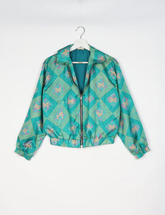 Upcycled Bomber Jacket made from recycled sari materials, featuring a cute cropped shape, elasticated hem and cuffs, and contrast sari print lining. Sustainable apparel promoting eco-friendly fashion and ethical clothing.