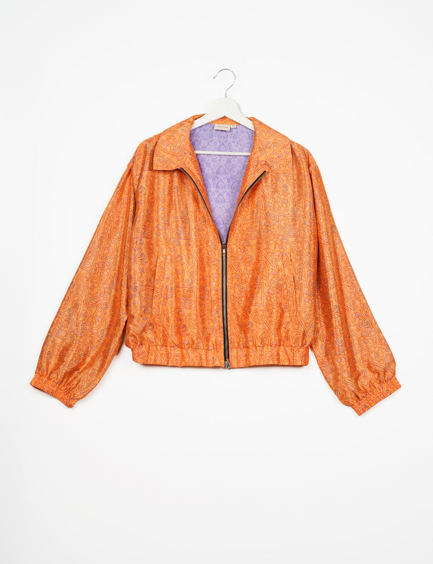 Stylish BOMBER JACKET, an upcycled clothing masterpiece with a cute cropped shape, elasticated details, and detachable metallic zipper. Contrast sari print lining adds a unique touch. Explore sustainable and eco-friendly fashion.