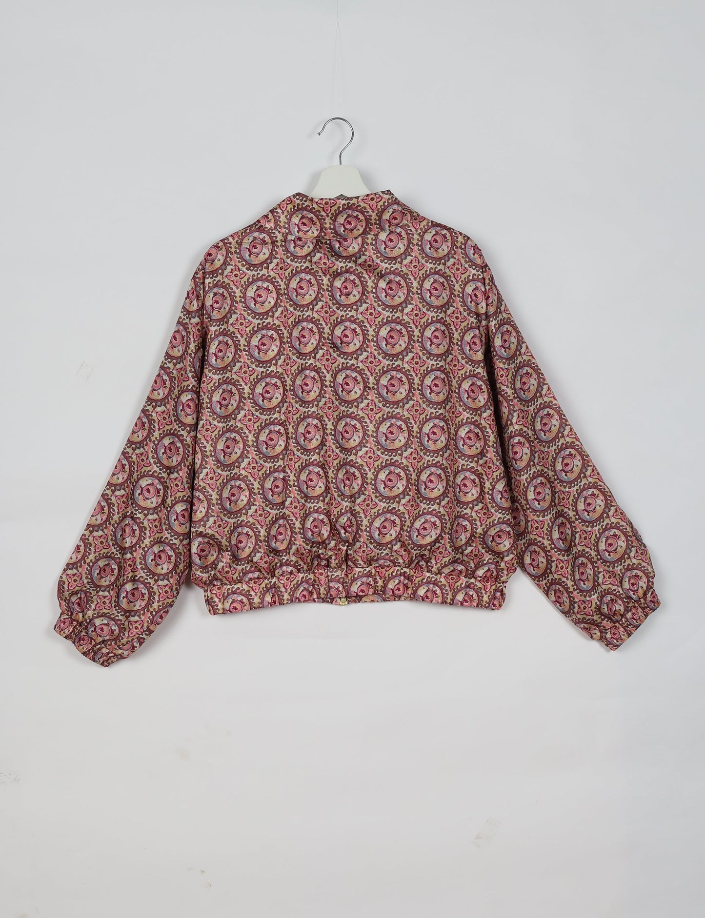 Upcycled Bomber Jacket made from recycled sari materials, featuring a cute cropped shape, elasticated hem and cuffs, and contrast sari print lining. Sustainable apparel promoting eco-friendly fashion and ethical clothing.