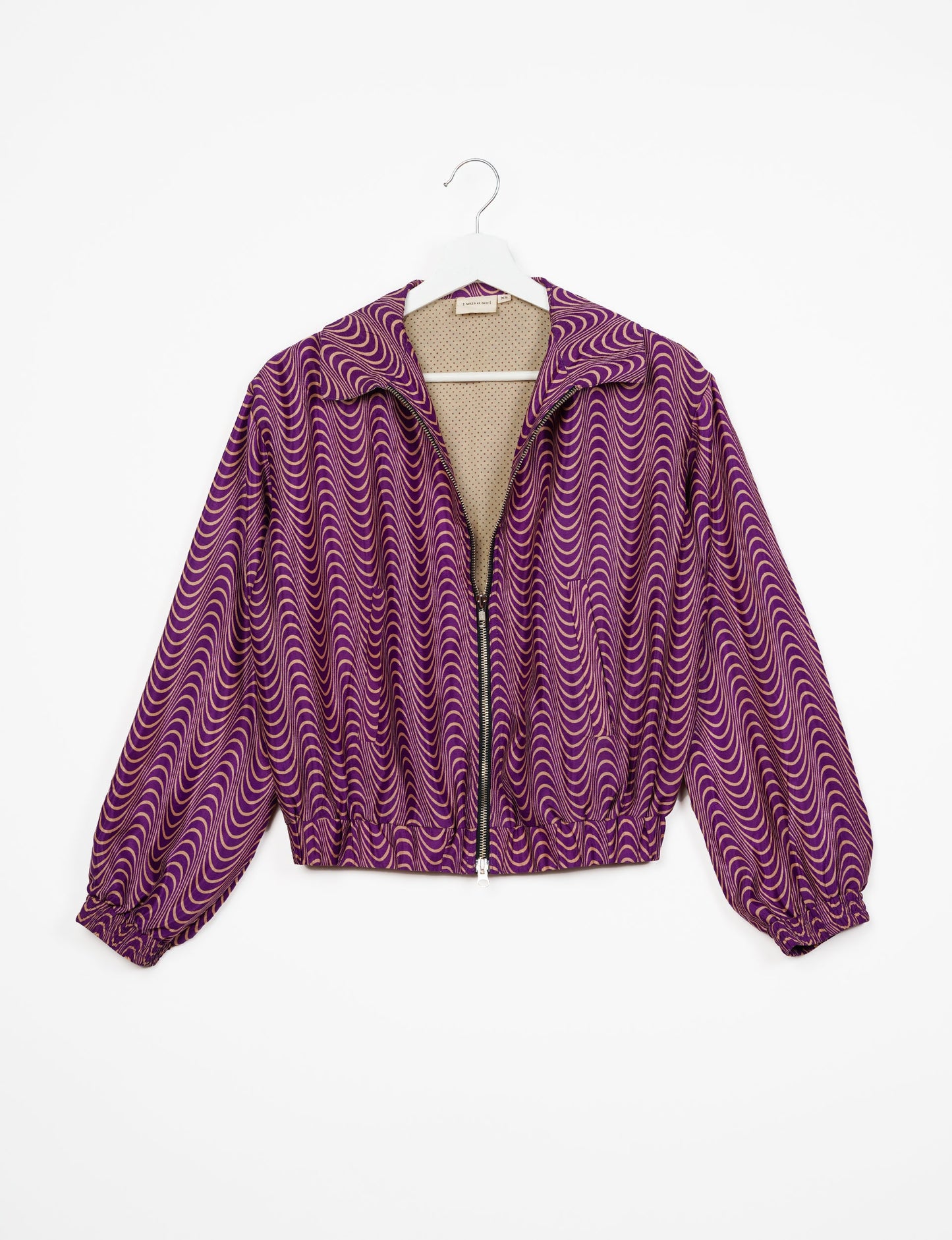 Stylish BOMBER JACKET, an upcycled clothing masterpiece with a cute cropped shape, elasticated details, and detachable metallic zipper. Contrast sari print lining adds a unique touch. Explore sustainable and eco-friendly fashion.