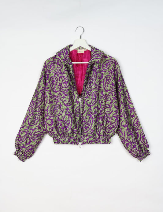 Upcycled Bomber Jacket made from recycled sari materials, featuring a cute cropped shape, elasticated hem and cuffs, and contrast sari print lining. Sustainable apparel promoting eco-friendly fashion and ethical clothing.