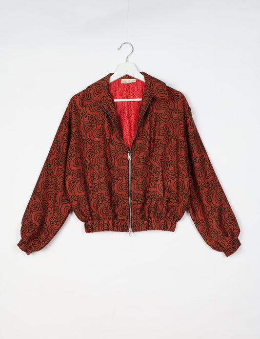 Upcycled Bomber Jacket made from recycled sari materials, featuring a cute cropped shape, elasticated hem and cuffs, and contrast sari print lining. Sustainable apparel promoting eco-friendly fashion and ethical clothing.