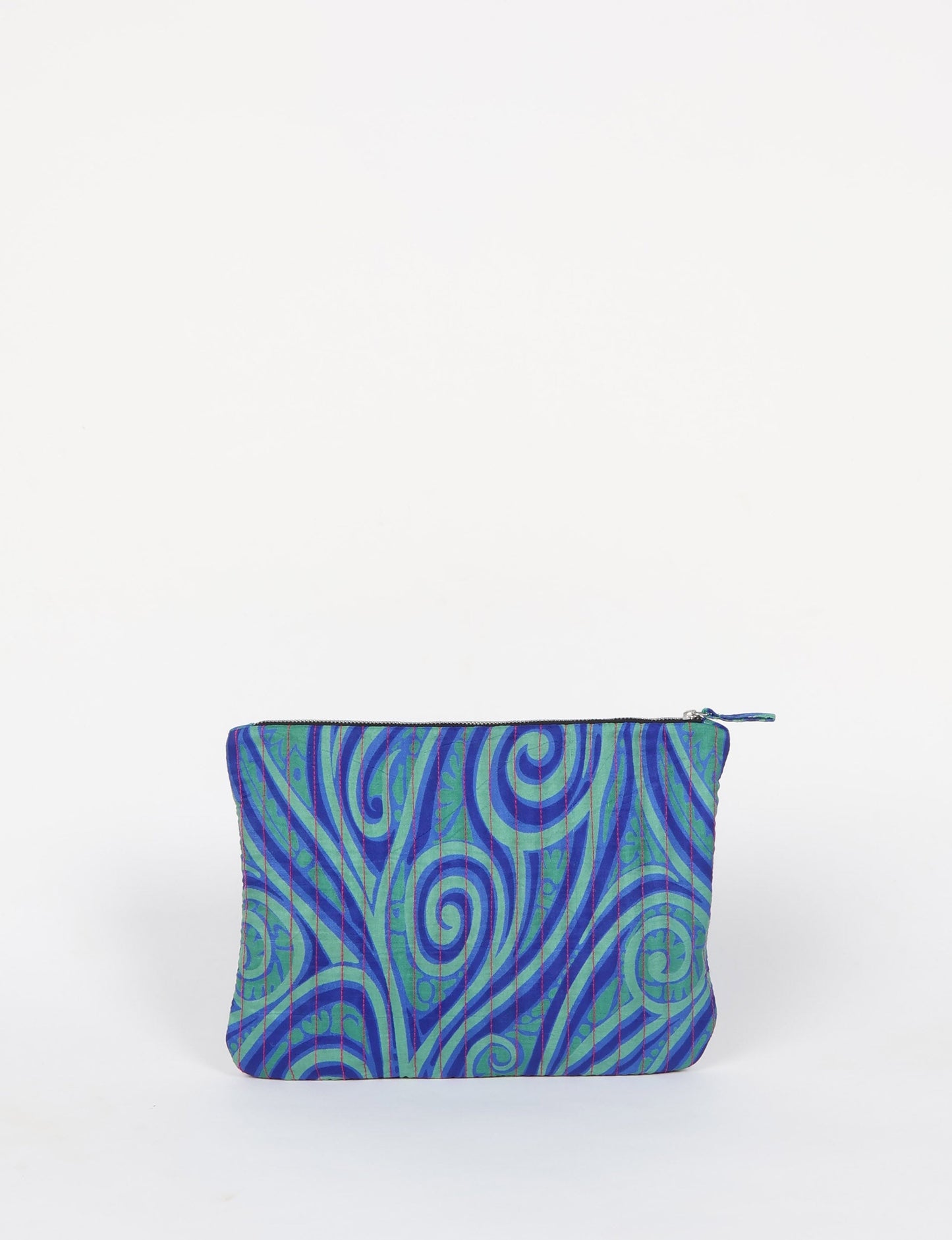 Elevate your accessory game with our QUILTED MAXI POUCH. Spacious enough for your i-pad mini, chargers, and more. Stay organized sustainably at home or on the move. Ethical fashion at its best!