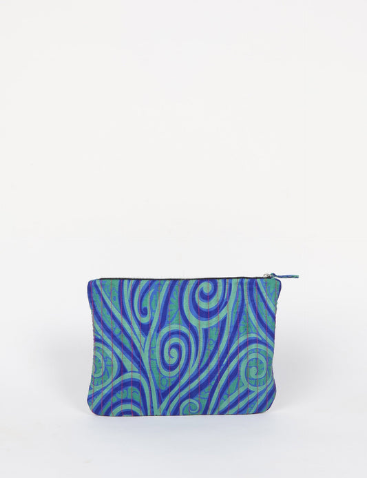 Elevate your accessory game with our QUILTED MAXI POUCH. Spacious enough for your i-pad mini, chargers, and more. Stay organized sustainably at home or on the move. Ethical fashion at its best!