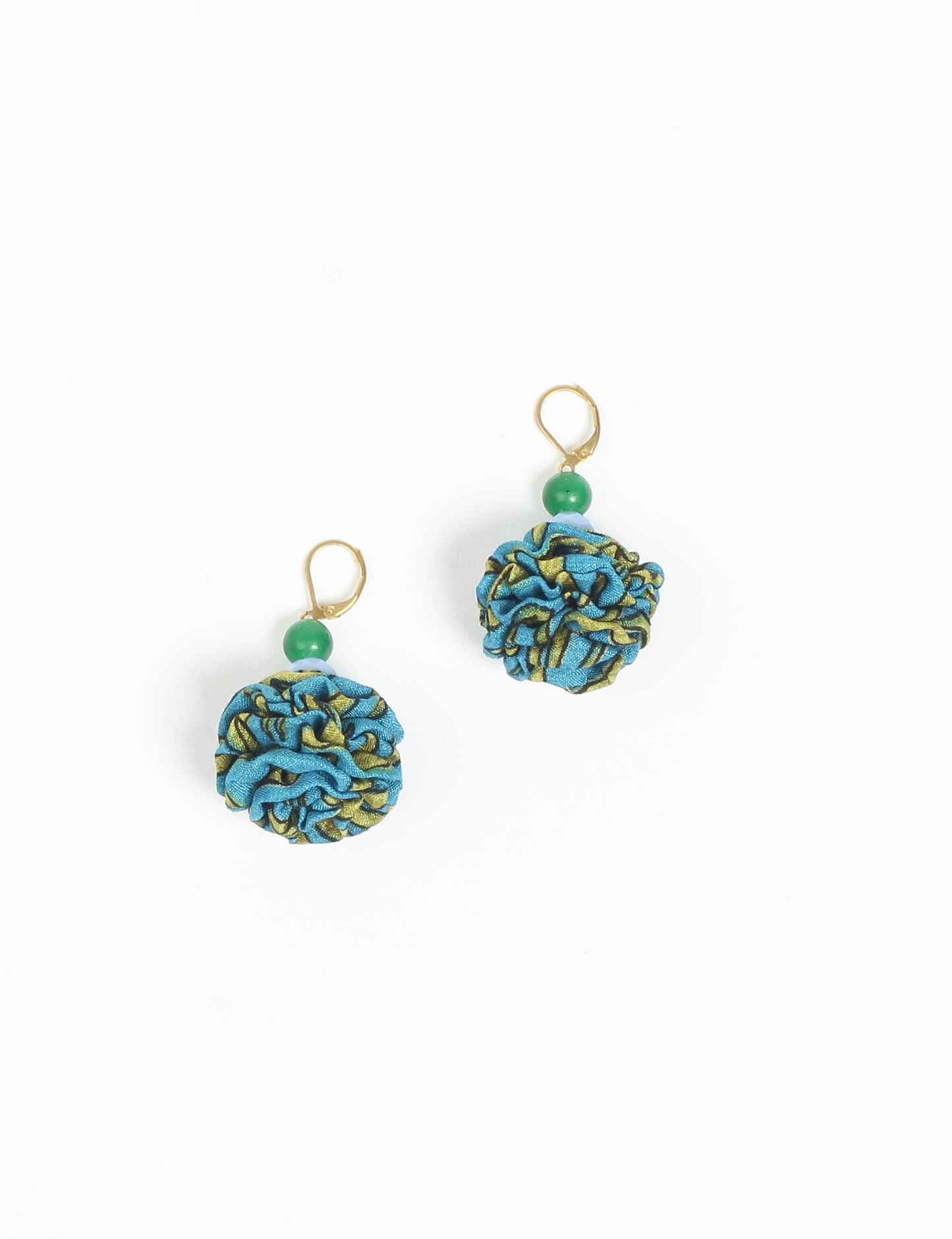 Elevate your style with our Ruffle Earrings, adorned with unique ruffle ball florets crafted from upcycled Indian saris using the traditional Aari embroidery technique. These sustainable earrings feature two glass beads and nickel-free, hypoallergenic metal hooks. Embrace ethical and green fashion with these statement pieces.