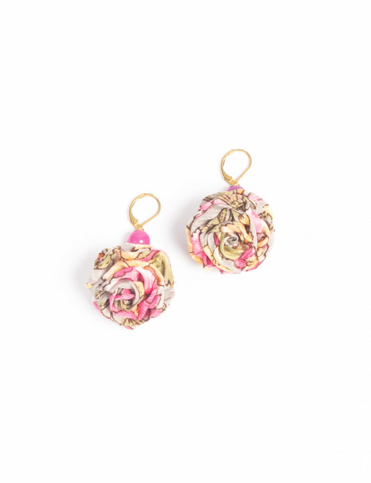 Elevate your style with our Ruffle Earrings, adorned with unique ruffle ball florets crafted from upcycled Indian saris using the traditional Aari embroidery technique. These sustainable earrings feature two glass beads and nickel-free, hypoallergenic metal hooks. Embrace ethical and green fashion with these statement pieces.