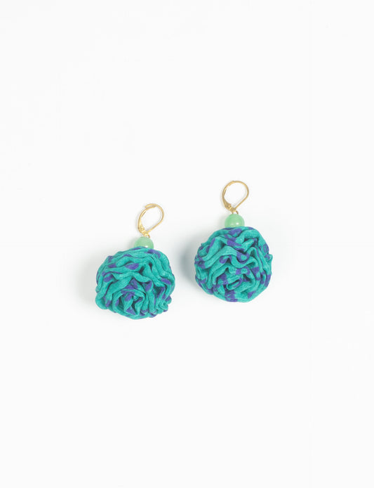 Elevate your style with our Ruffle Earrings, adorned with unique ruffle ball florets crafted from upcycled Indian saris using the traditional Aari embroidery technique. These sustainable earrings feature two glass beads and nickel-free, hypoallergenic metal hooks. Embrace ethical and green fashion with these statement pieces.