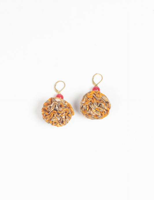 Elevate your style with our Ruffle Earrings, adorned with unique ruffle ball florets crafted from upcycled Indian saris using the traditional Aari embroidery technique. These sustainable earrings feature two glass beads and nickel-free, hypoallergenic metal hooks. Embrace ethical and green fashion with these statement pieces.