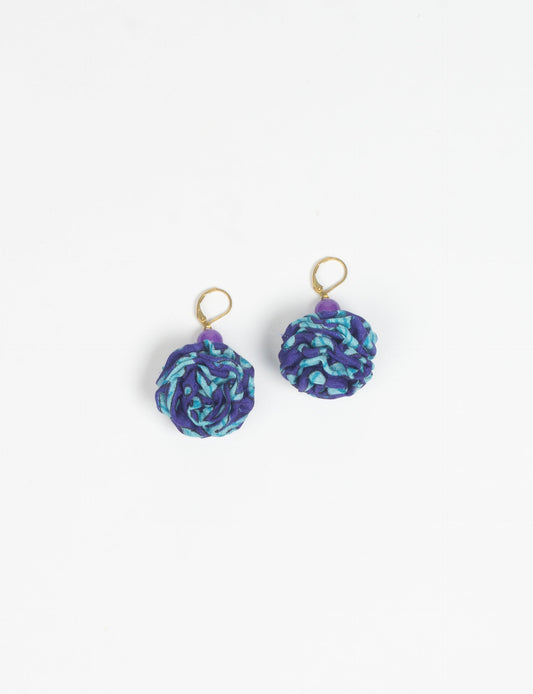 Elevate your style with our Ruffle Earrings, adorned with unique ruffle ball florets crafted from upcycled Indian saris using the traditional Aari embroidery technique. These sustainable earrings feature two glass beads and nickel-free, hypoallergenic metal hooks. Embrace ethical and green fashion with these statement pieces.