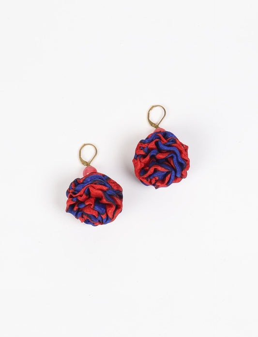 Elevate your style with our Ruffle Earrings, adorned with unique ruffle ball florets crafted from upcycled Indian saris using the traditional Aari embroidery technique. These sustainable earrings feature two glass beads and nickel-free, hypoallergenic metal hooks. Embrace ethical and green fashion with these statement pieces.