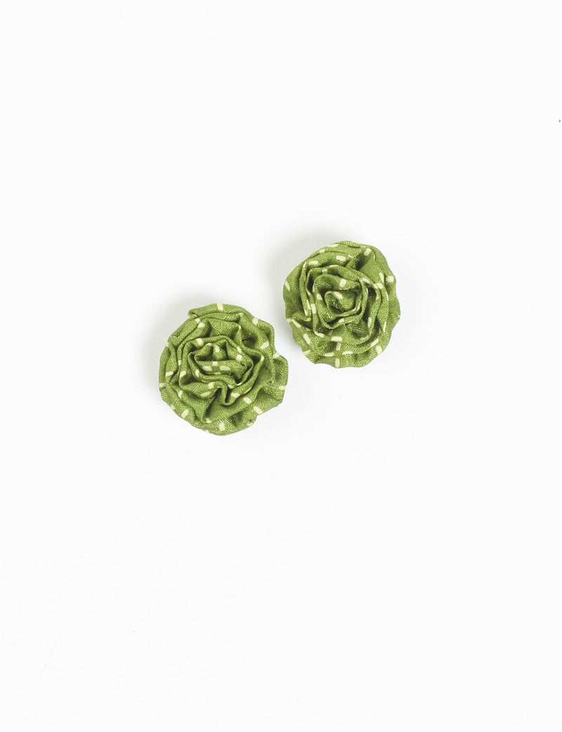 Pair of green fabric ruffle earrings with a micro white dot pattern, shown flat on a white background