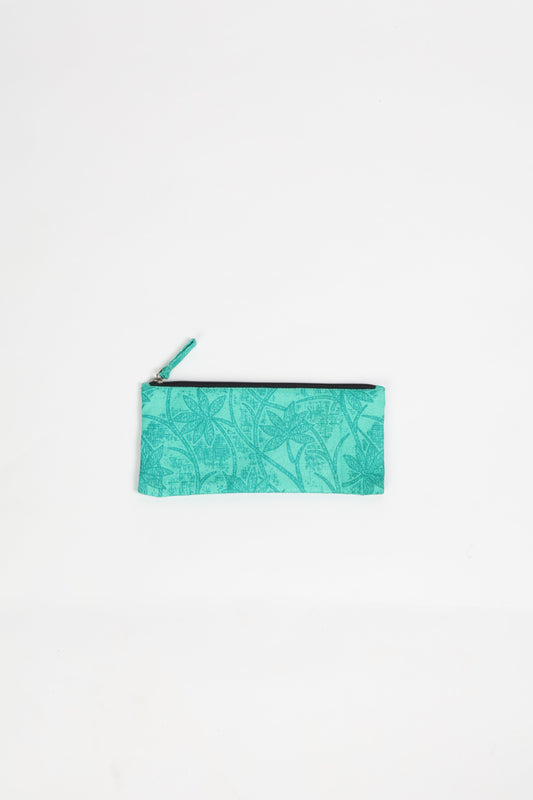Eco-conscious quilted pencil pouch with waterproof lining made from upcycled garments, reflecting the values of circular fashion, carbon neutral fashion, and repurposed clothing. A perfect example of green fashion and sustainable women's clothing.