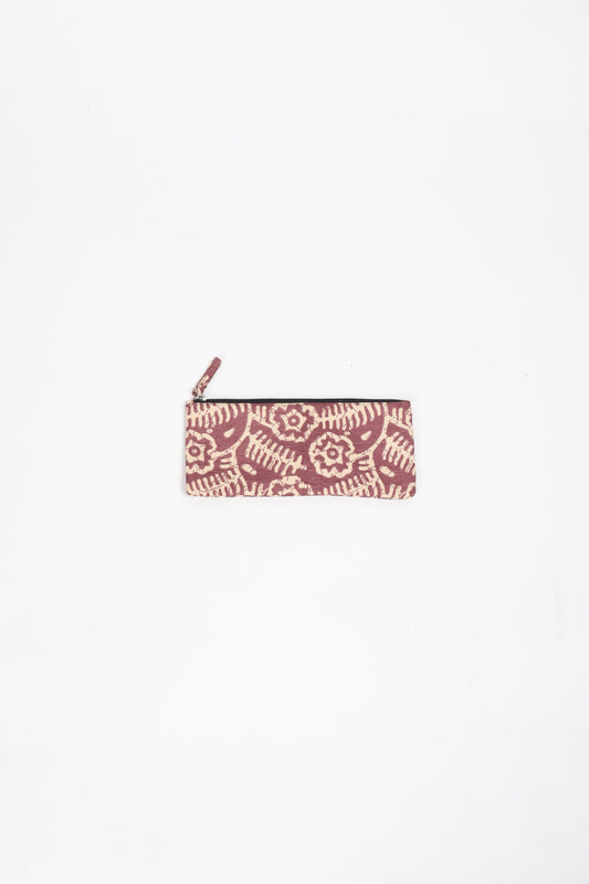 Eco-conscious quilted pencil pouch with waterproof lining made from upcycled garments, reflecting the values of circular fashion, carbon neutral fashion, and repurposed clothing. A perfect example of green fashion and sustainable women's clothing.