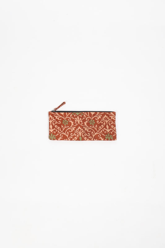 Eco-conscious quilted pencil pouch with waterproof lining made from upcycled garments, reflecting the values of circular fashion, carbon neutral fashion, and repurposed clothing. A perfect example of green fashion and sustainable women's clothing.