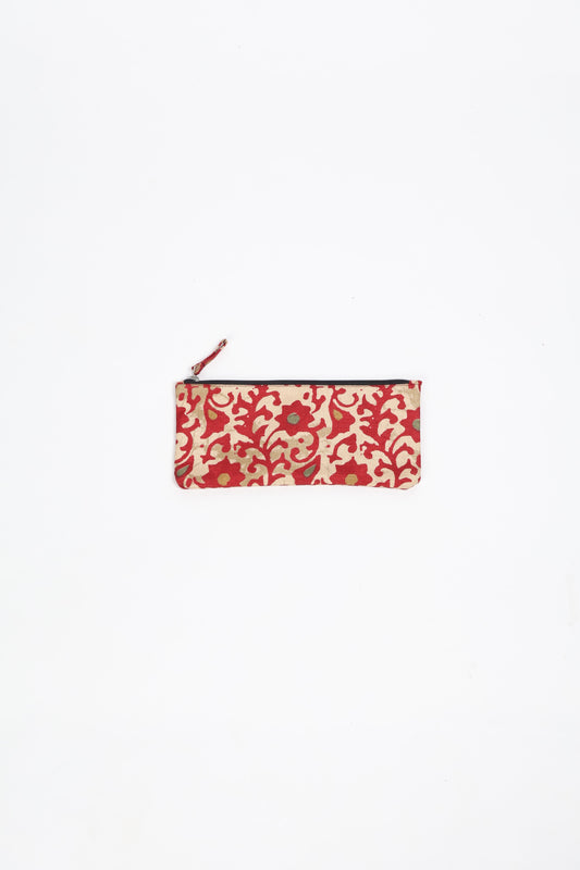 Eco-conscious quilted pencil pouch with waterproof lining made from upcycled garments, reflecting the values of circular fashion, carbon neutral fashion, and repurposed clothing. A perfect example of green fashion and sustainable women's clothing.