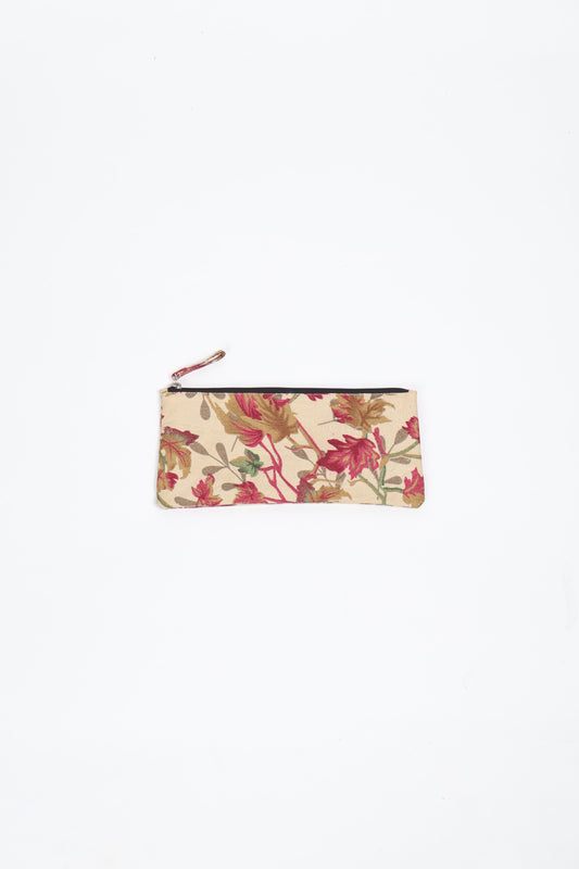 Eco-conscious quilted pencil pouch with waterproof lining made from upcycled garments, reflecting the values of circular fashion, carbon neutral fashion, and repurposed clothing. A perfect example of green fashion and sustainable women's clothing.