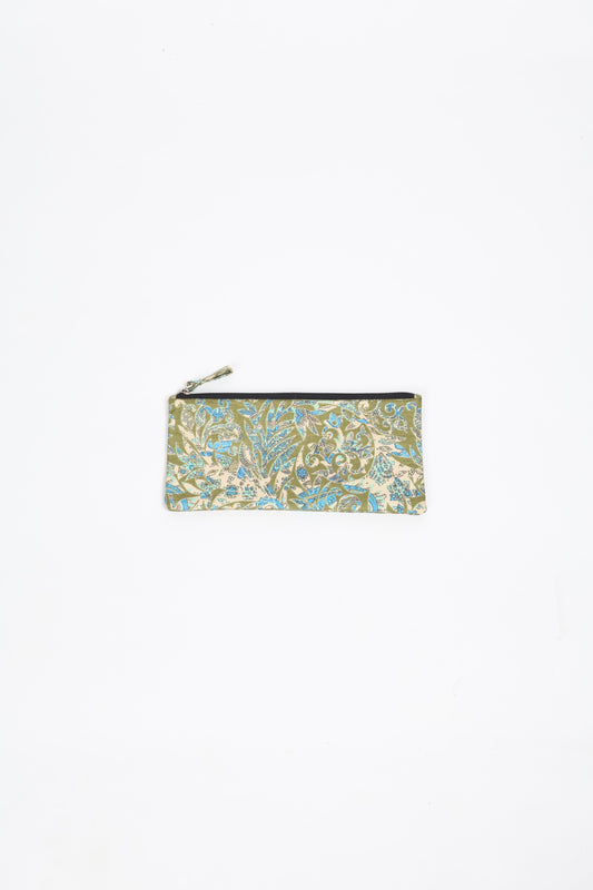 Eco-conscious quilted pencil pouch with waterproof lining made from upcycled garments, reflecting the values of circular fashion, carbon neutral fashion, and repurposed clothing. A perfect example of green fashion and sustainable women's clothing.