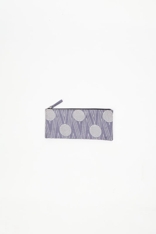 Eco-conscious quilted pencil pouch with waterproof lining made from upcycled garments, reflecting the values of circular fashion, carbon neutral fashion, and repurposed clothing. A perfect example of green fashion and sustainable women's clothing.