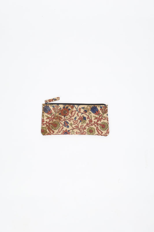 Eco-conscious quilted pencil pouch with waterproof lining made from upcycled garments, reflecting the values of circular fashion, carbon neutral fashion, and repurposed clothing. A perfect example of green fashion and sustainable women's clothing.