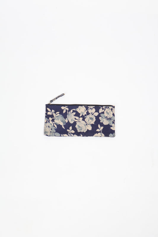 Eco-conscious quilted pencil pouch with waterproof lining made from upcycled garments, reflecting the values of circular fashion, carbon neutral fashion, and repurposed clothing. A perfect example of green fashion and sustainable women's clothing.