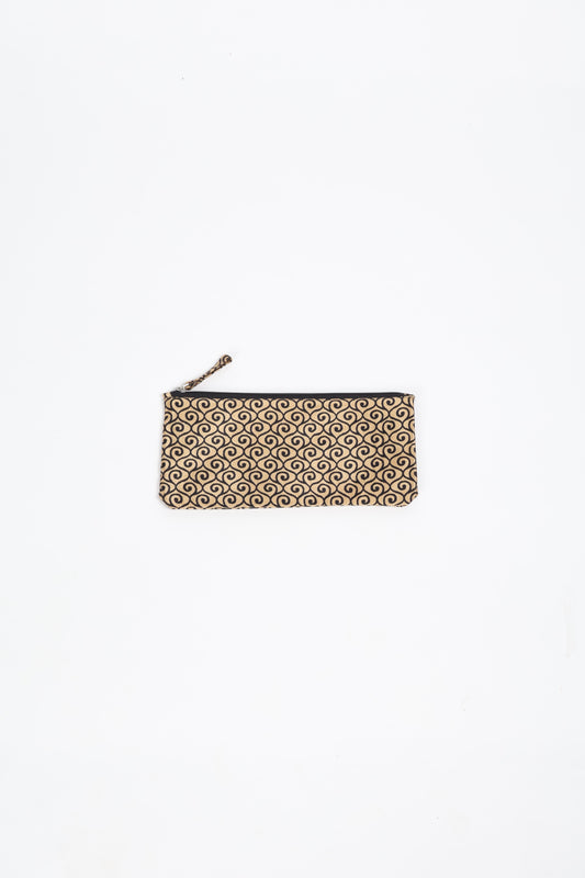 Eco-conscious quilted pencil pouch with waterproof lining made from upcycled garments, reflecting the values of circular fashion, carbon neutral fashion, and repurposed clothing. A perfect example of green fashion and sustainable women's clothing.