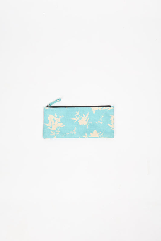 Eco-conscious quilted pencil pouch with waterproof lining made from upcycled garments, reflecting the values of circular fashion, carbon neutral fashion, and repurposed clothing. A perfect example of green fashion and sustainable women's clothing.