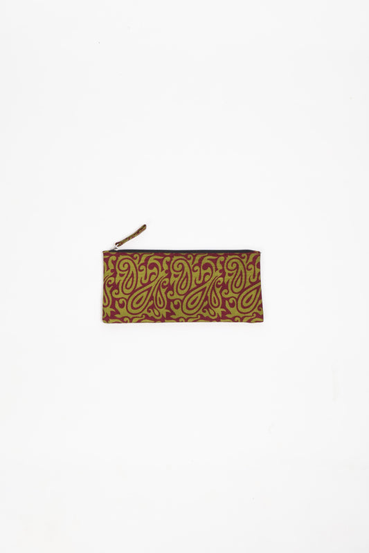 Eco-conscious quilted pencil pouch with waterproof lining made from upcycled garments, reflecting the values of circular fashion, carbon neutral fashion, and repurposed clothing. A perfect example of green fashion and sustainable women's clothing.